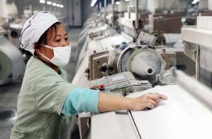 manufacturing operations female worker at machine