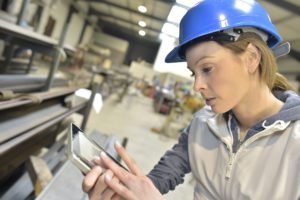 Female manufacturing worker with hard hat