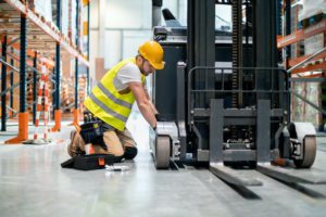 Man conducting forklift inspection